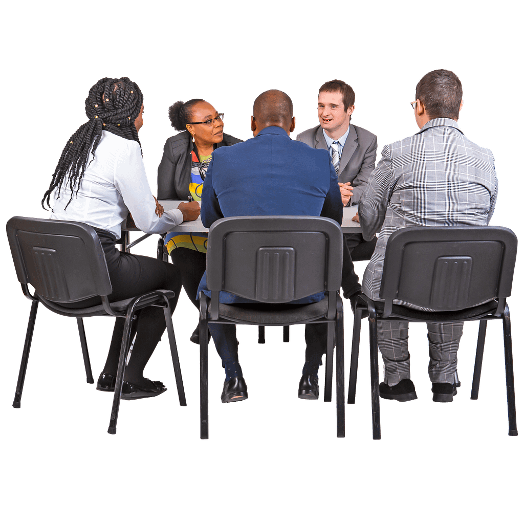 A group of five people sit in a circle talking