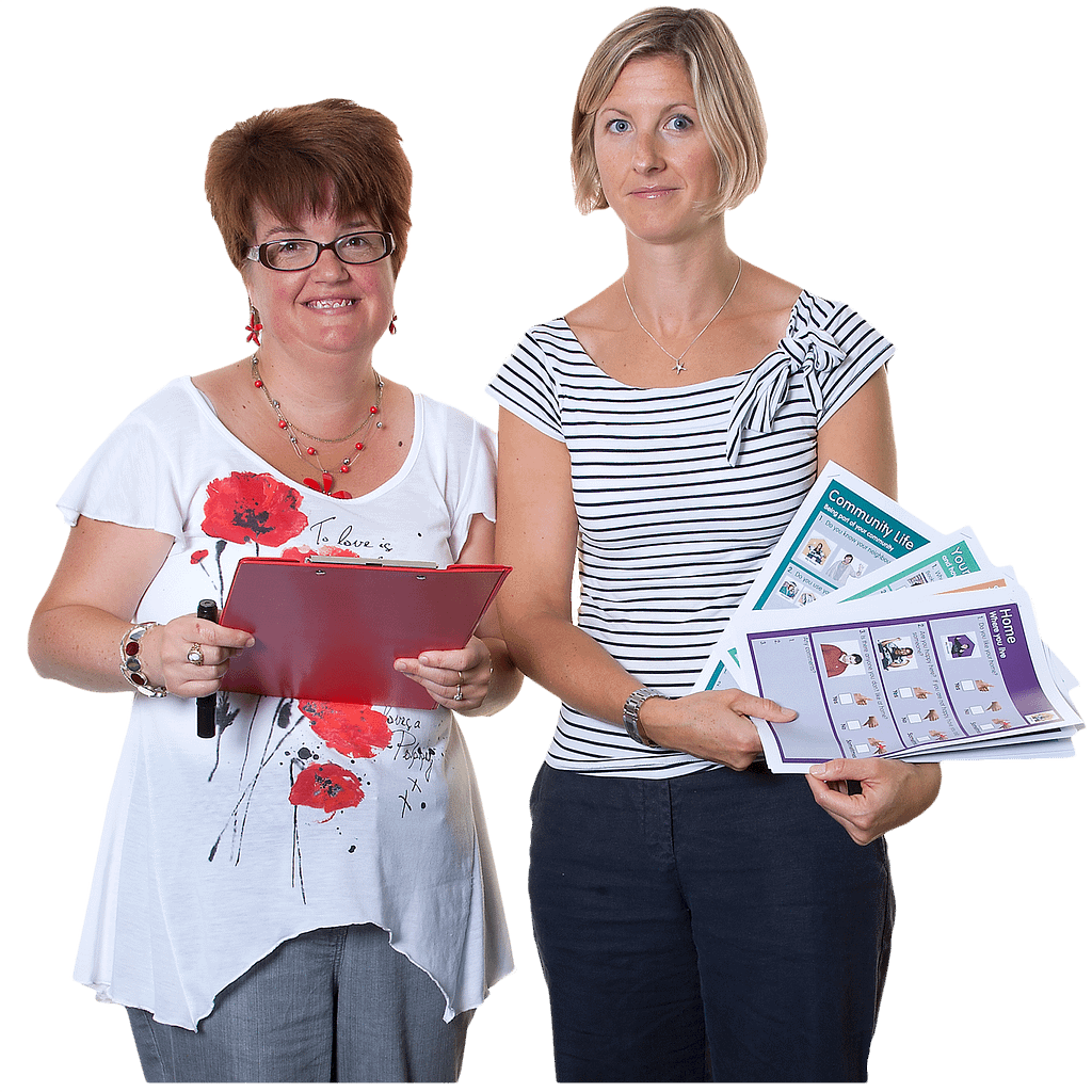 Two women stand side by side and hold folders and documents
